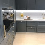 Blue kitchen cabinets with gold hardware