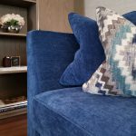 blue couch with pillows