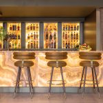 bar with stools and bottles